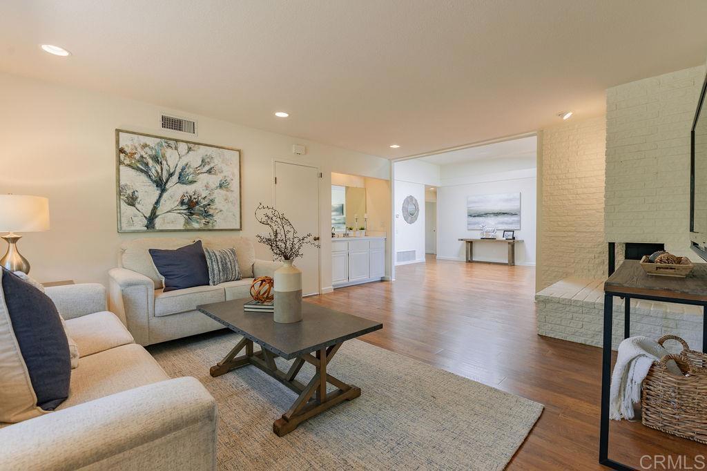 13321 Canyon Back Lane Poway, CA 92064 - Photo 6 of 26 a living room with furniture and a wooden floor