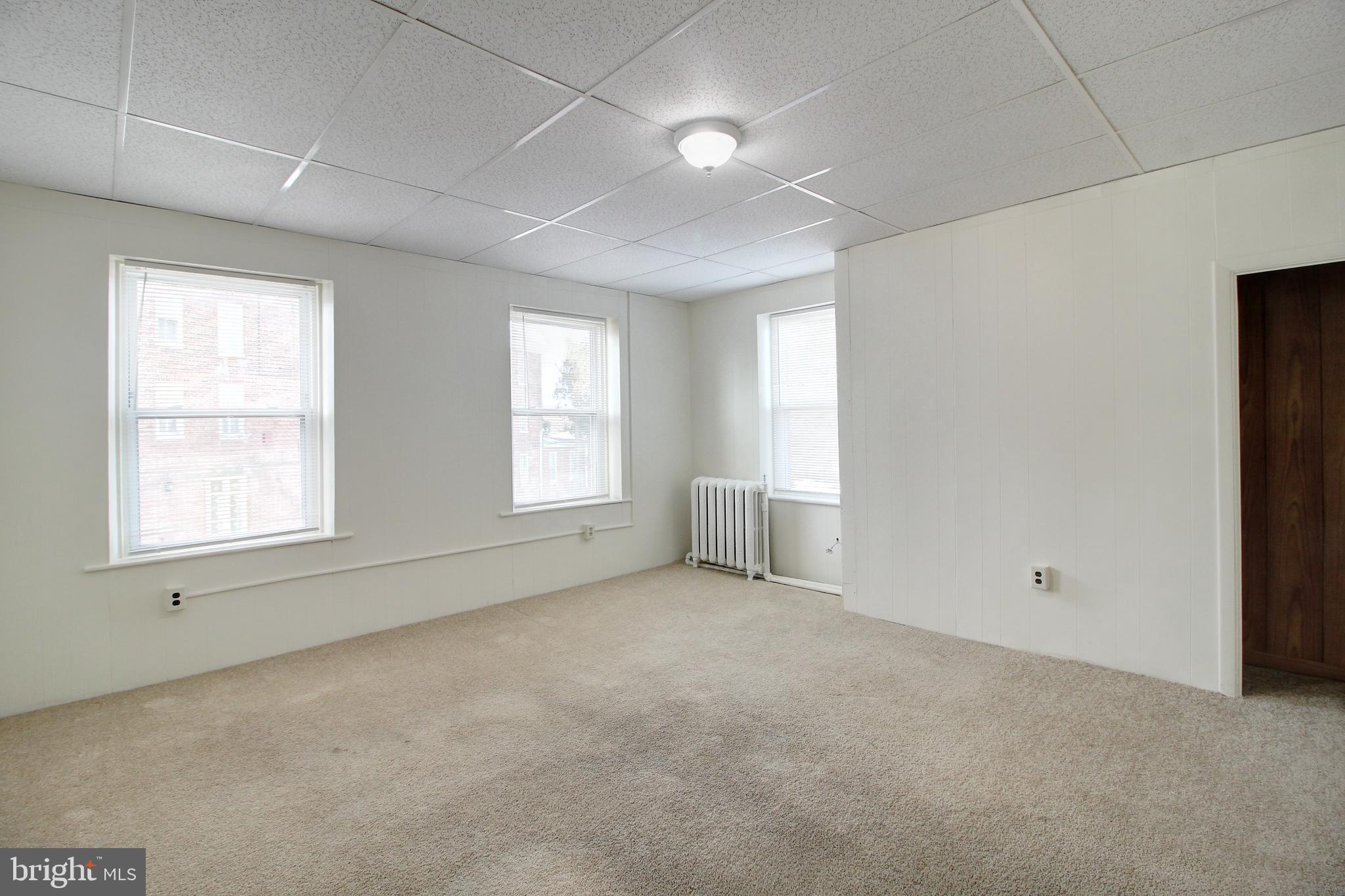 604 West Main Street, Unit 3 Emmitsburg, MD 21727 - Photo 4 of 13 an empty room with windows