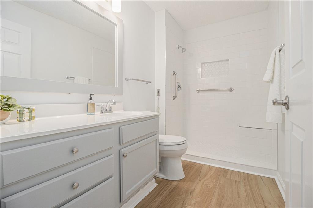300 Johnson Ferry Road, Unit A203 Sandy Springs, GA 30328 - Photo 8 of 14 a bathroom with a sink and a mirror