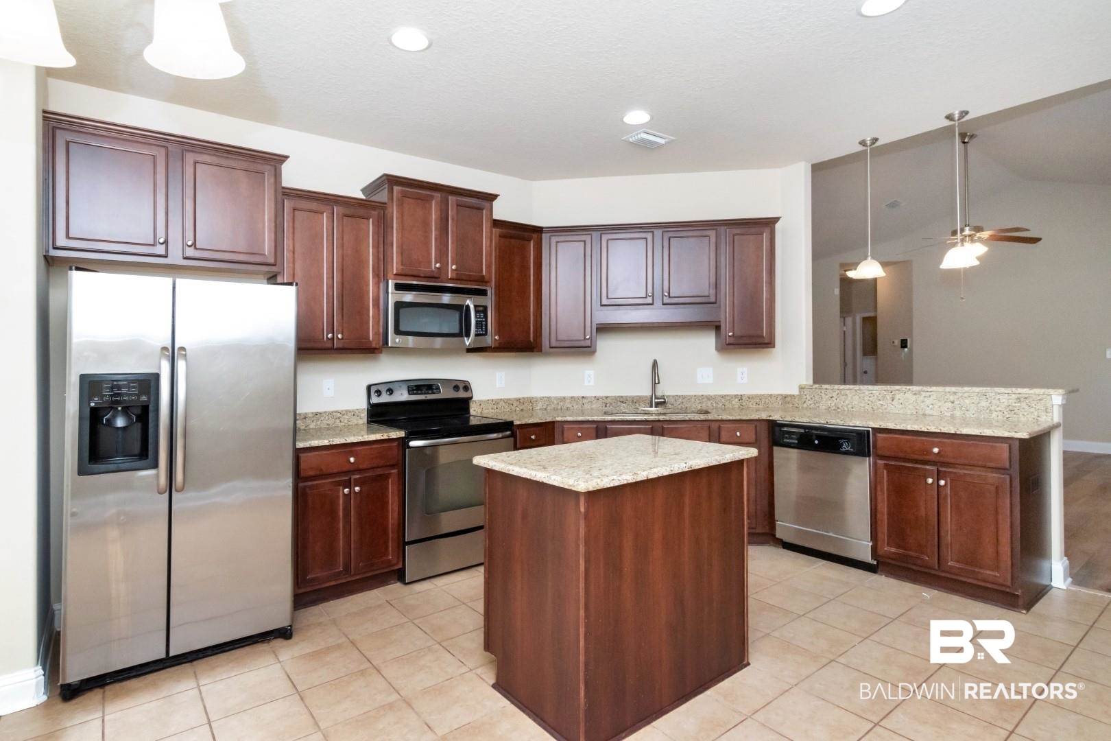 6144 Whitebark Drive Mobile, AL 36693 - Photo 10 of 33 Kitchen with ceiling fan, sink, hanging light fixtures, lofted ceiling, and appliances with stainless steel finishes