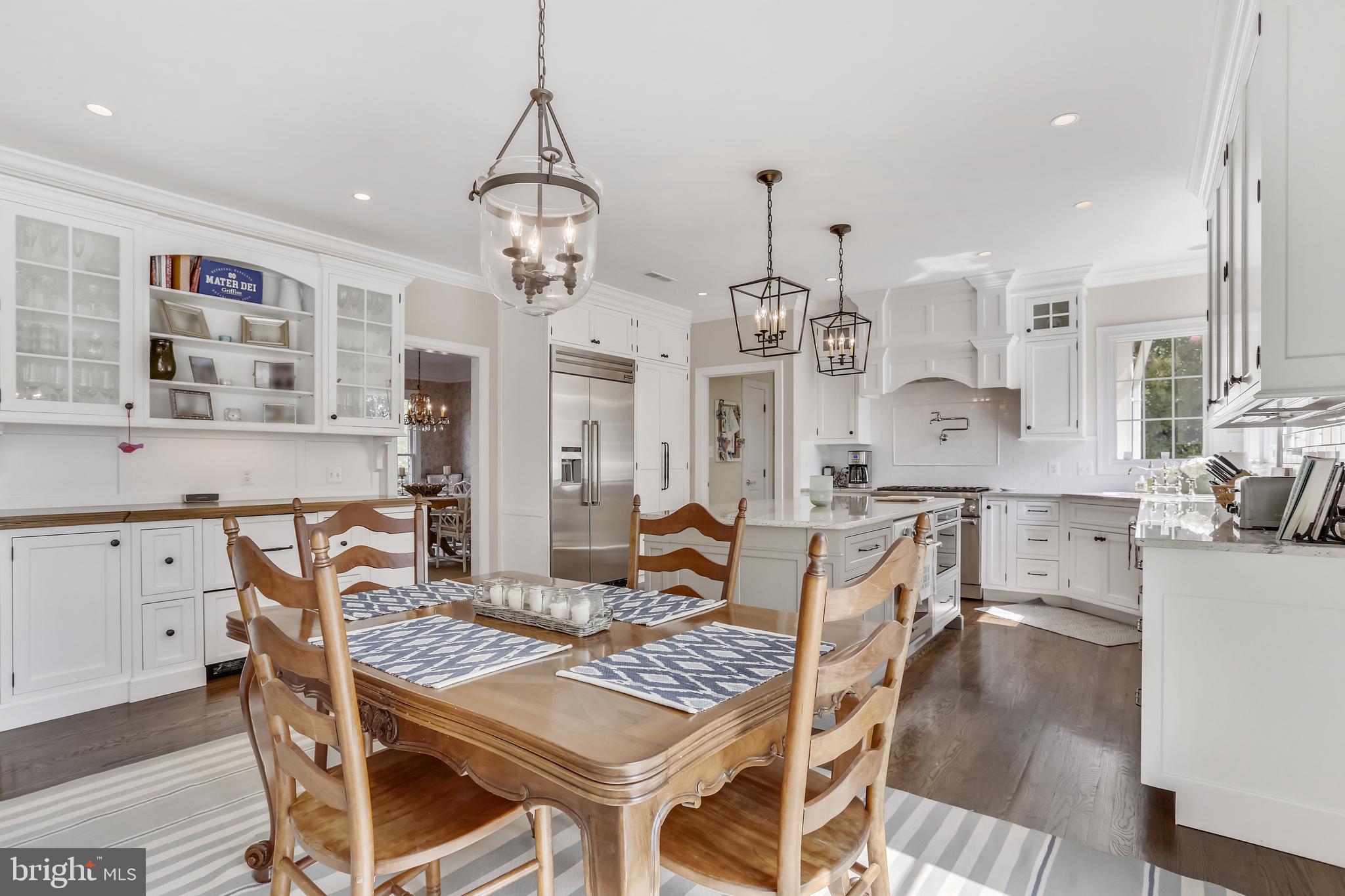 2113 Link Road Silver Spring, MD 20905 - Photo 5 of 78 a view of a dining room with furniture and wooden floor