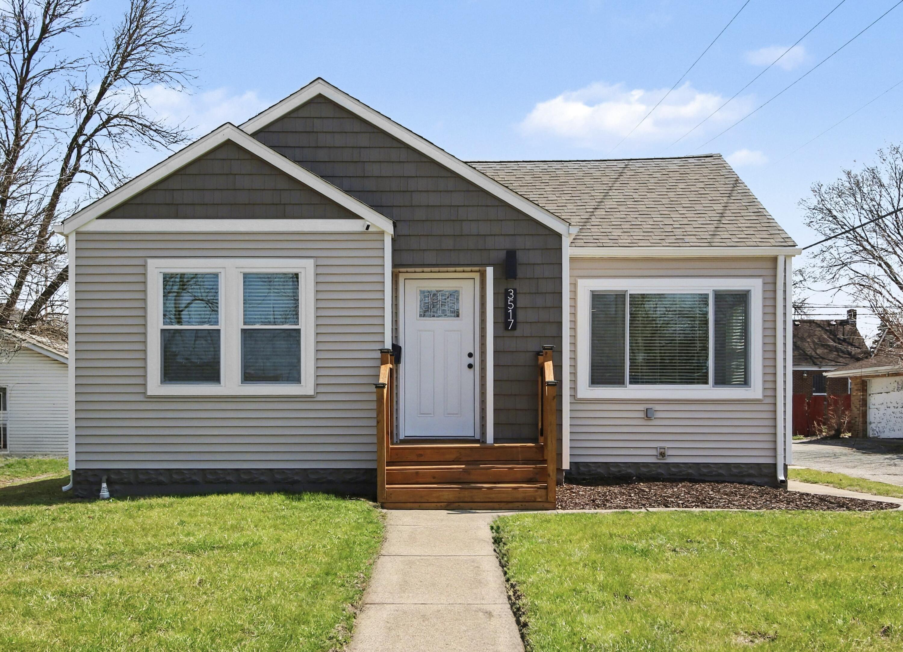 3517 Buchanan Street Gary, IN 46408 - Photo 1 of 18 a front view of a house with a yard