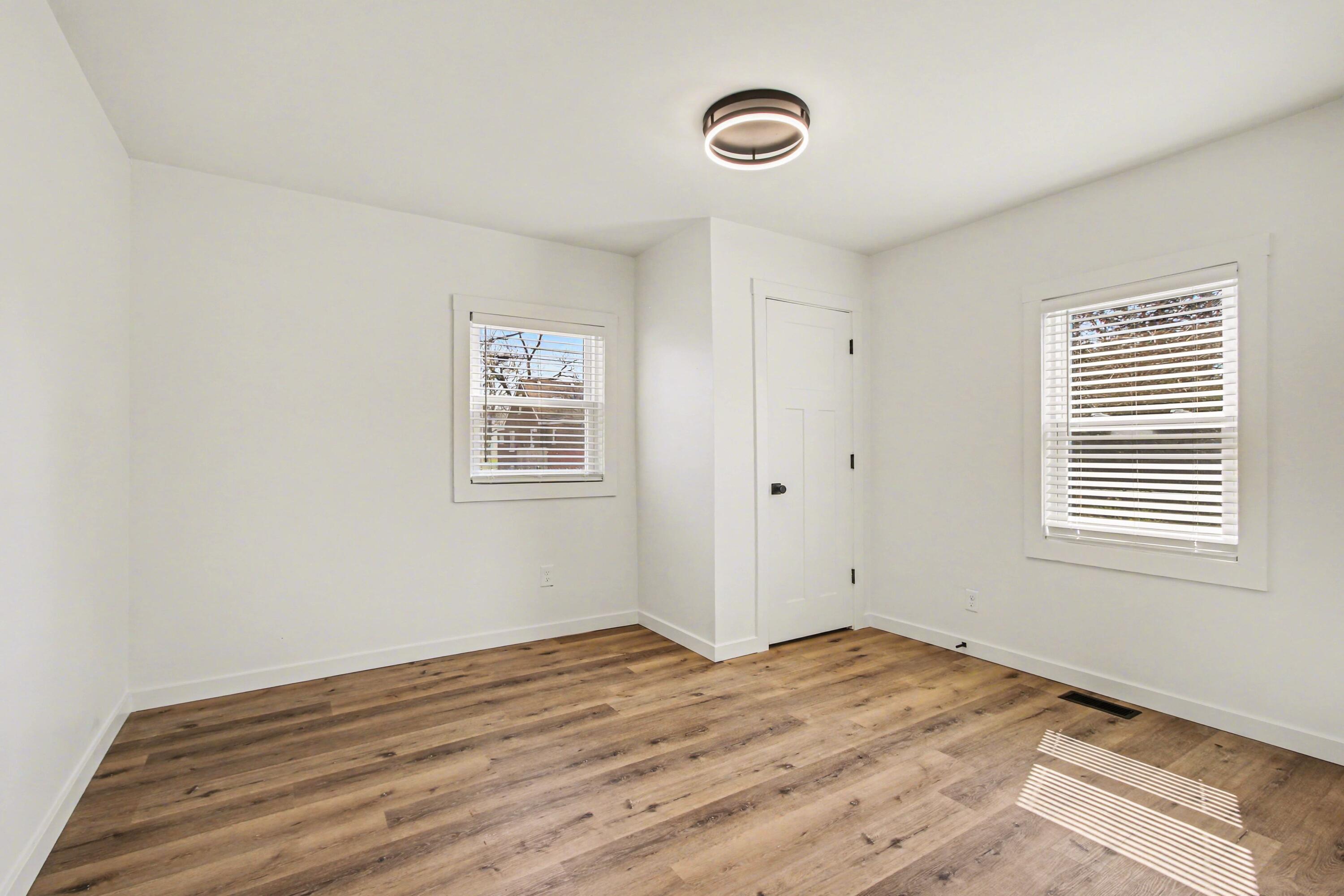 3517 Buchanan Street Gary, IN 46408 - Photo 11 of 18 a view of a room with wooden floor and windows