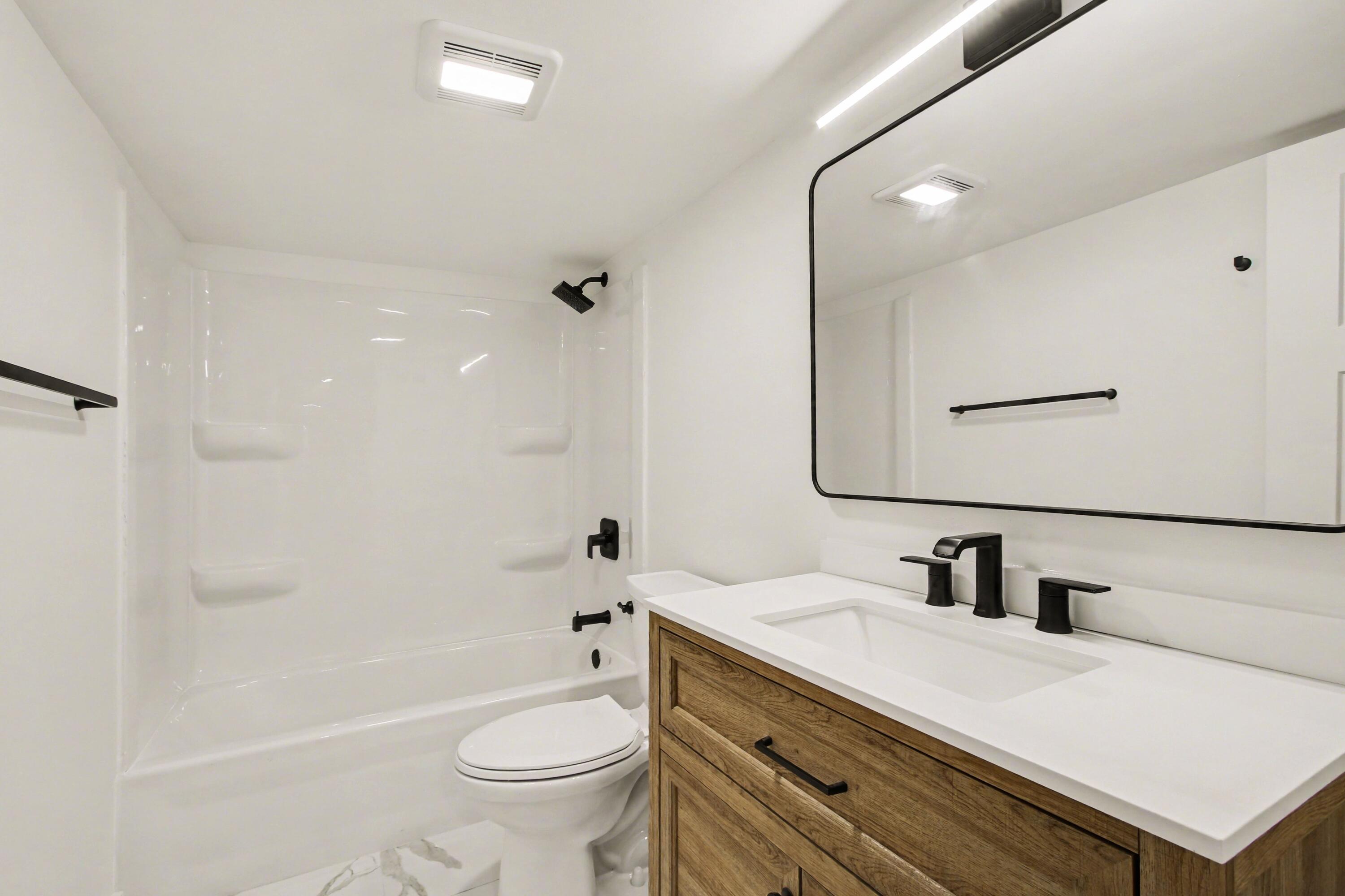 3517 Buchanan Street Gary, IN 46408 - Photo 15 of 18 a bathroom with a sink a toilet and shower