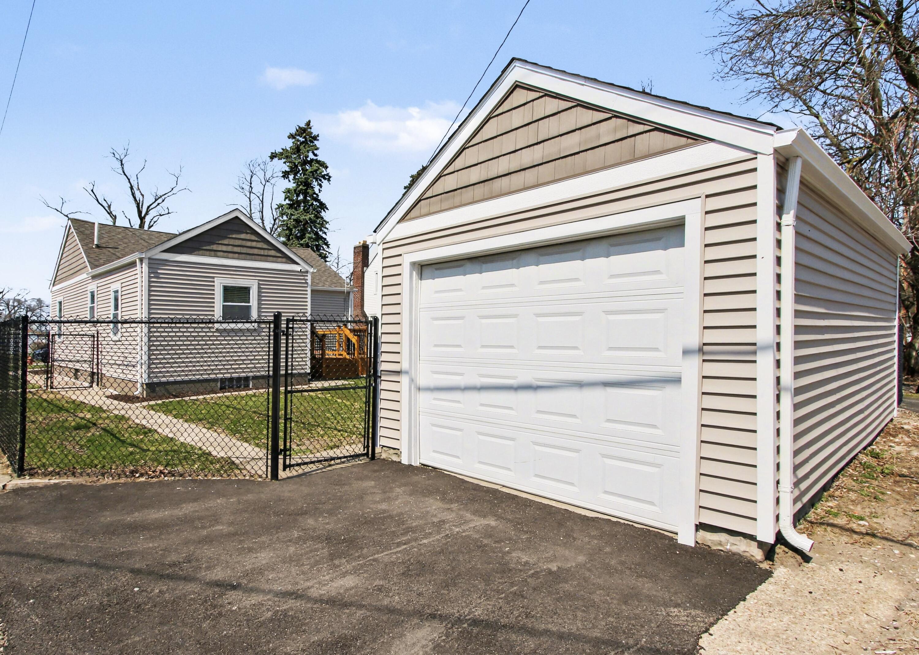 3517 Buchanan Street Gary, IN 46408 - Photo 18 of 18 a view of a house with a yard and garage