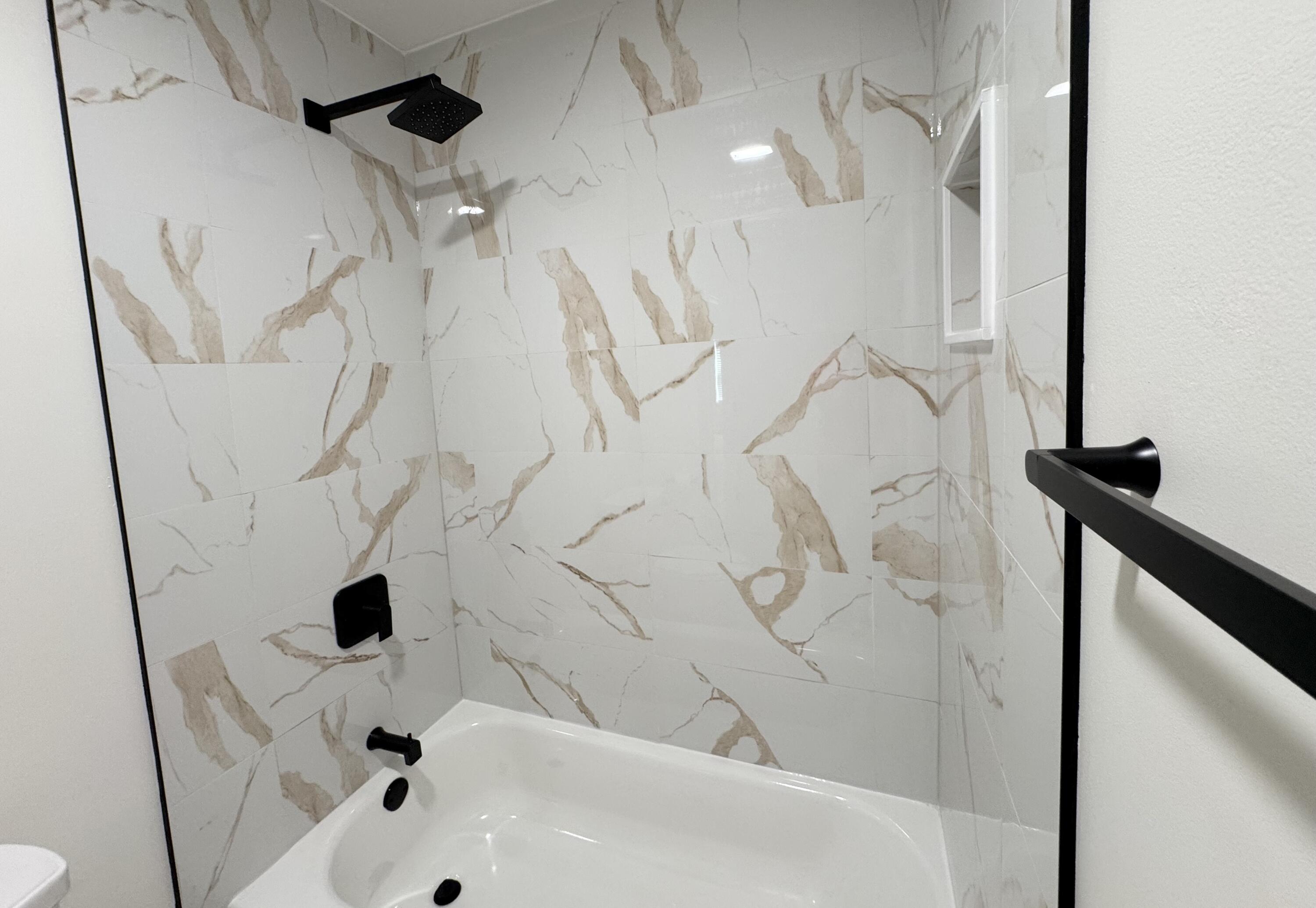 3517 Buchanan Street Gary, IN 46408 - Photo 7 of 18 a bathroom with a bathtub and shower