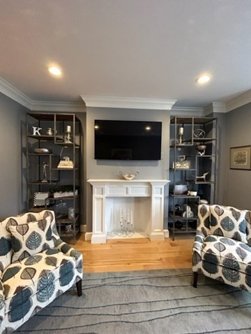 483 Beacon Street, Unit 41 Boston, MA 02115 - Photo 2 of 7 a living room with furniture and a flat screen tv