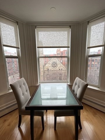 483 Beacon Street, Unit 41 Boston, MA 02115 - Photo 3 of 7 a view of a dining room with furniture and window