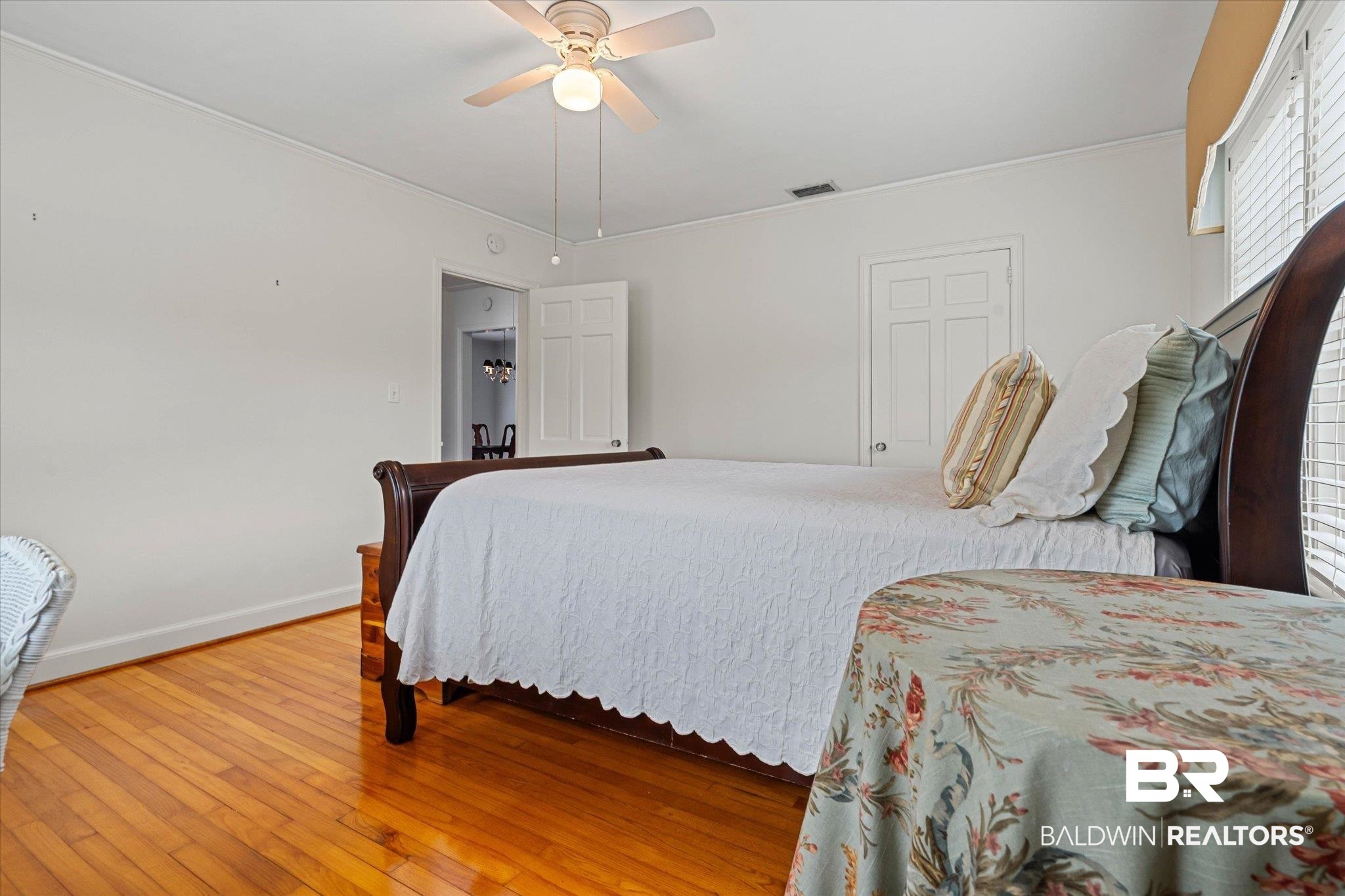 300 Woodlands Avenue Mobile, AL 36607 - Photo 13 of 23 Bedroom featuring hardwood / wood-style flooring, crown molding, and a ceiling fan