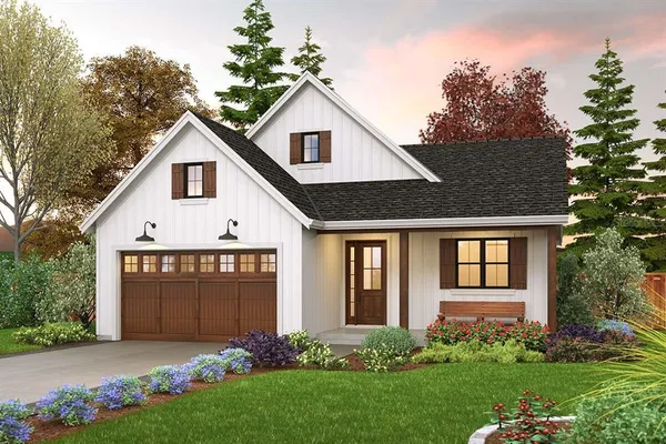 a front view of a house with a garden
