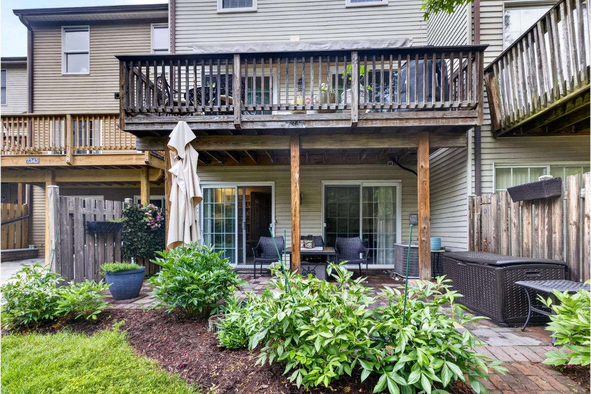 7347 Swan Point Way, Unit 122 Columbia, MD 21045 - Photo 41 of 54 a view of a house with large windows and plants
