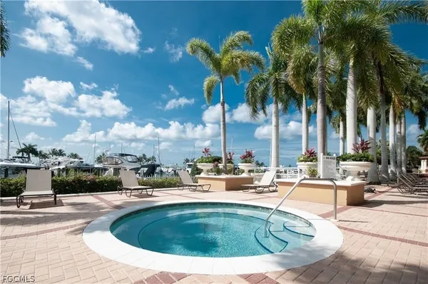 a view of swimming pool with outdoor seating