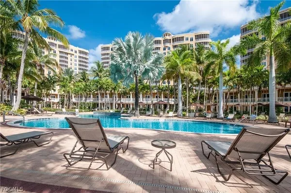 a view of a patio with a table and chairs