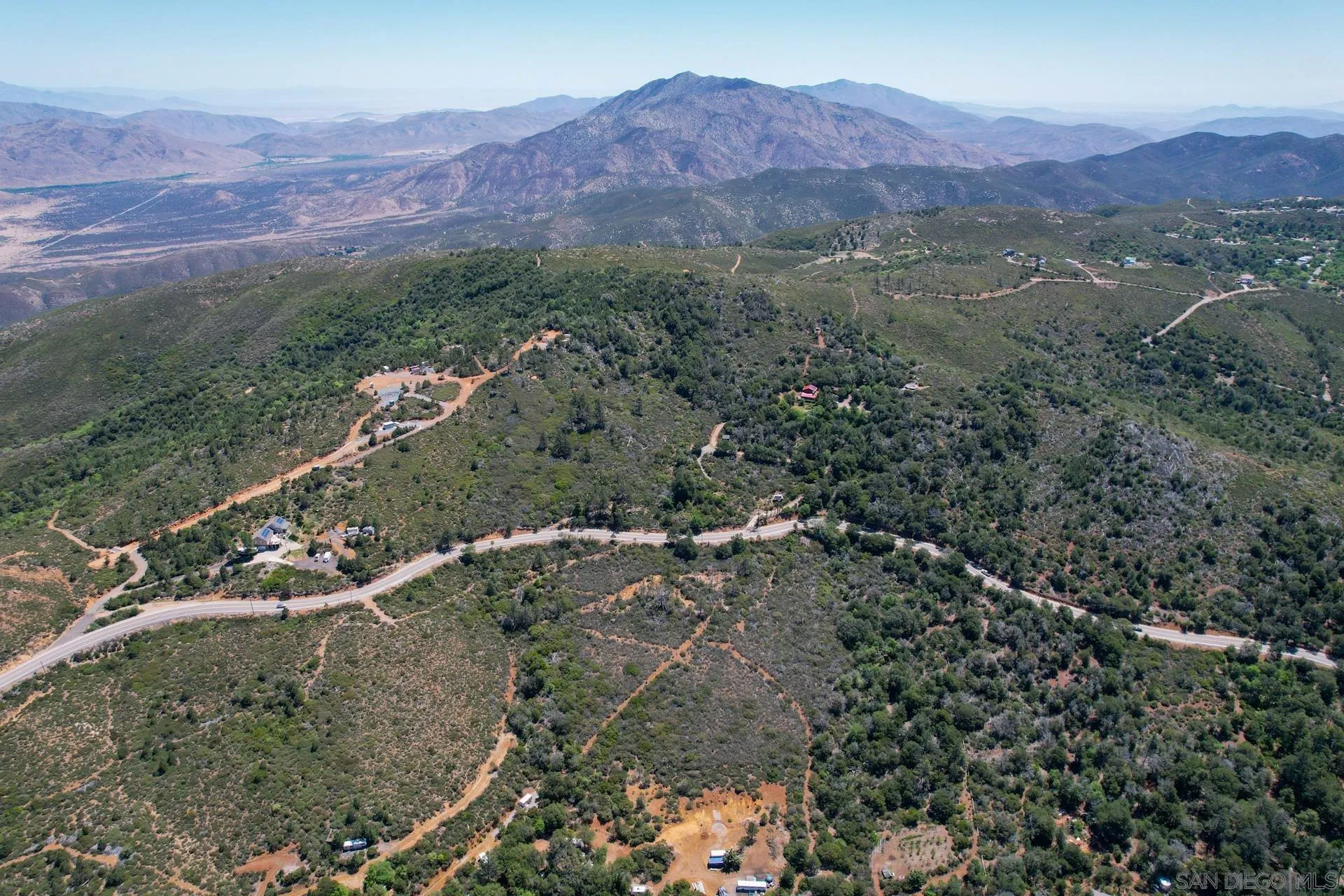 0 Highway 79 Julian, CA 92036 - Photo 2 of 11 a view of a lush green hillside and a houses