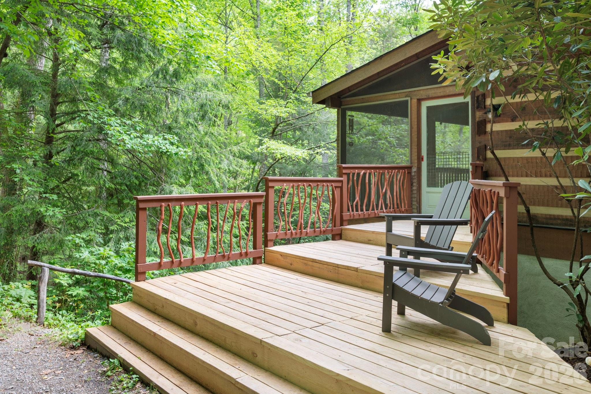 14 Weeping Cherry Forest Road Fairview, NC 28730 - Photo 1 of 44 a view of a wooden deck and a backyard