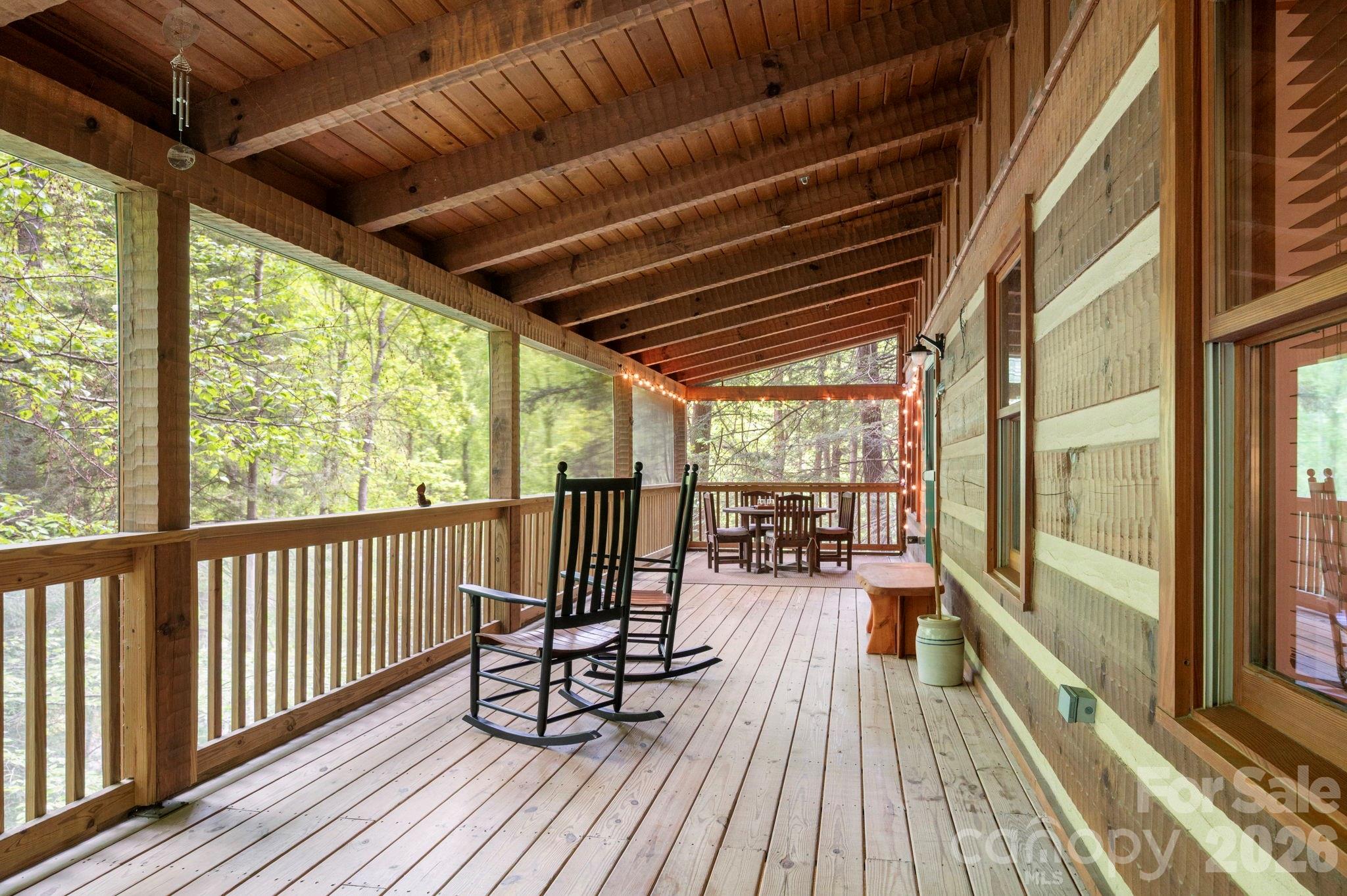 14 Weeping Cherry Forest Road Fairview, NC 28730 - Photo 7 of 44 a view of balcony with couch and wooden floor