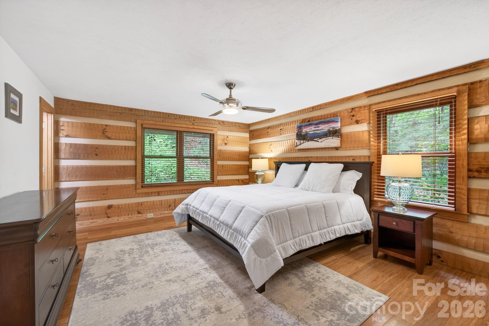14 Weeping Cherry Forest Road Fairview, NC 28730 - Photo 9 of 44 a large bed sitting in a bedroom next to a window