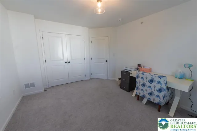 a bed room with a bed and a couch