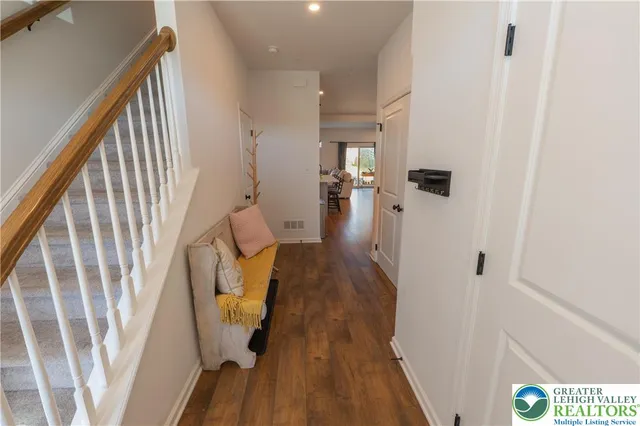 a view of entryway with wooden floor