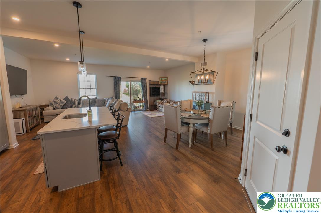 543 Long Street Emmaus, PA 18049 - Photo 5 of 18 a living room with furniture dining table and a wooden floor