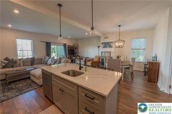 a large kitchen with a table and chairs