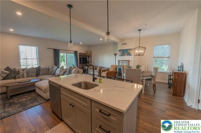 a large kitchen with a table and chairs