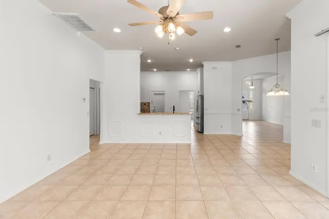 a view of a hallway with a kitchen