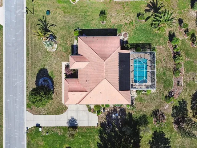 an aerial view of a house with a garden