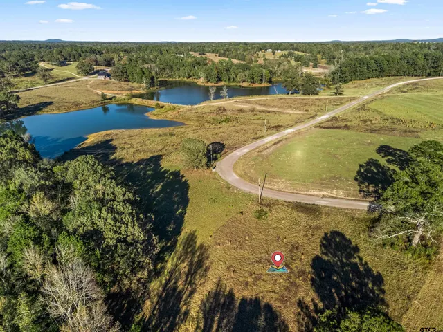 a view of a swimming pool and an outdoor seating