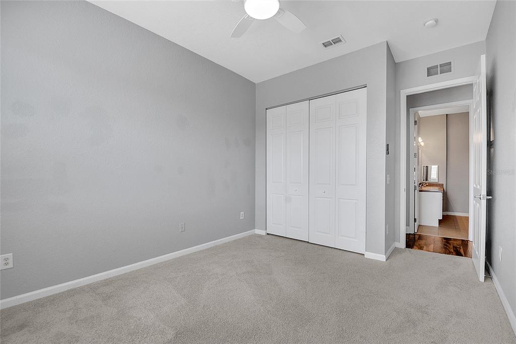 617 Terrace Ridge Circle, Unit 617 Davenport, FL 33896 - Photo 13 of 42 a view of a room with a walk in closet and a bathroom