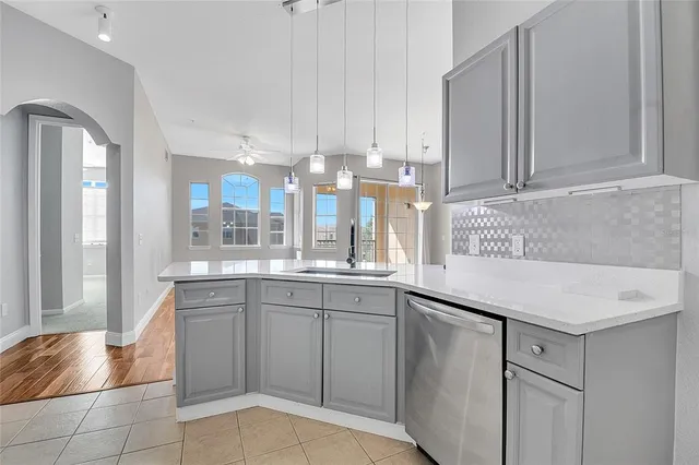 a kitchen with a sink cabinets and window