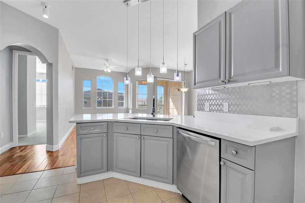 617 Terrace Ridge Circle, Unit 617 Davenport, FL 33896 - Photo 32 of 42 a kitchen with a sink cabinets and window