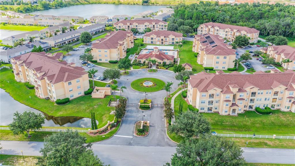 617 Terrace Ridge Circle, Unit 617 Davenport, FL 33896 - Photo 40 of 42 an aerial view of multiple houses with yard