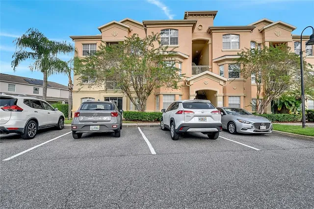 a view of a cars parked in front of a house