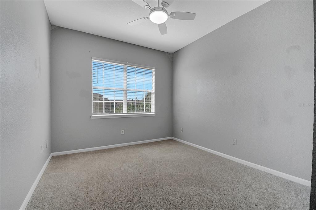 617 Terrace Ridge Circle, Unit 617 Davenport, FL 33896 - Photo 10 of 42 an empty room with a window