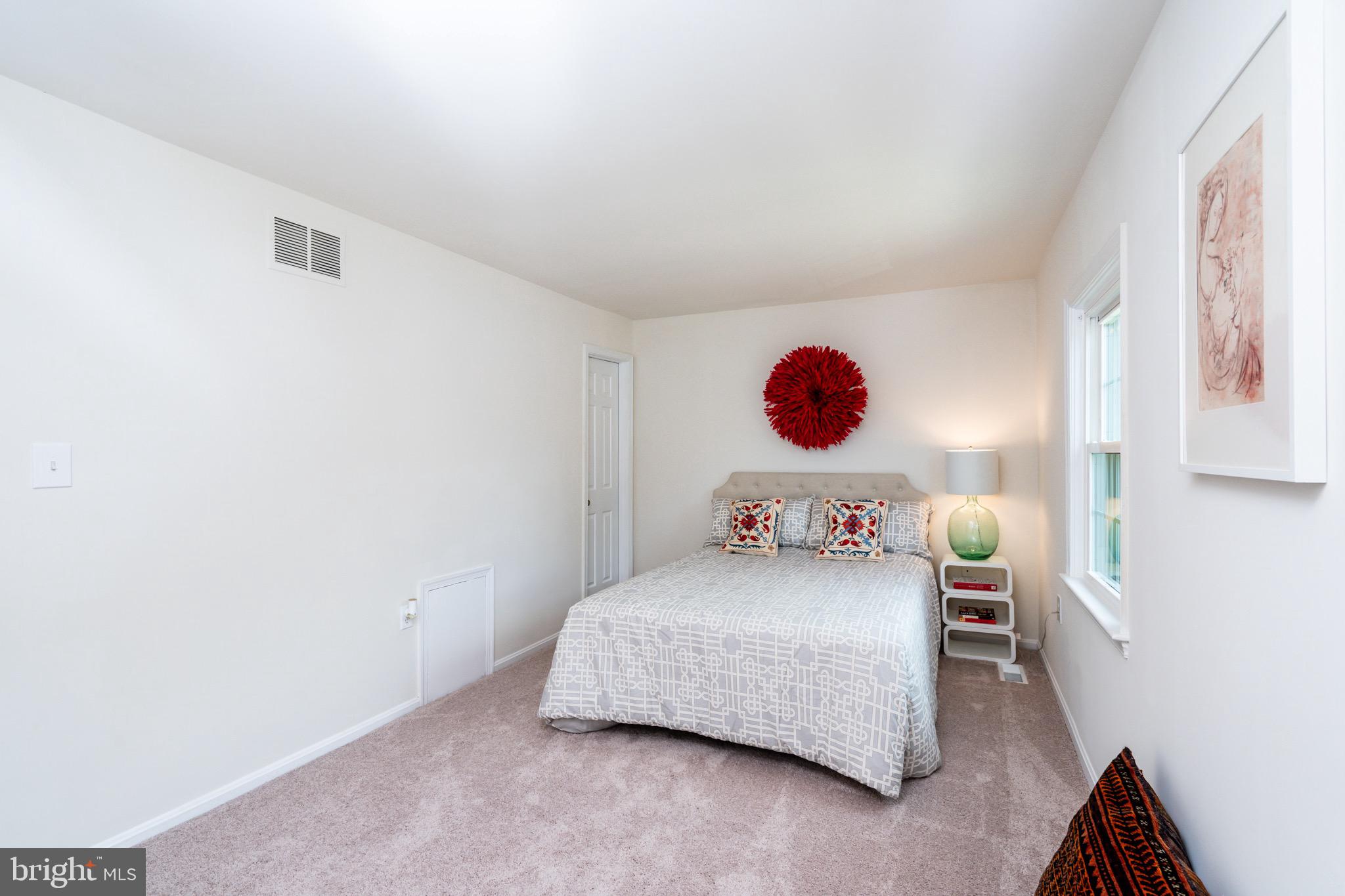 6490 Franconia Road Springfield, VA 22150 - Photo 14 of 34 a bedroom with a bed and a large window