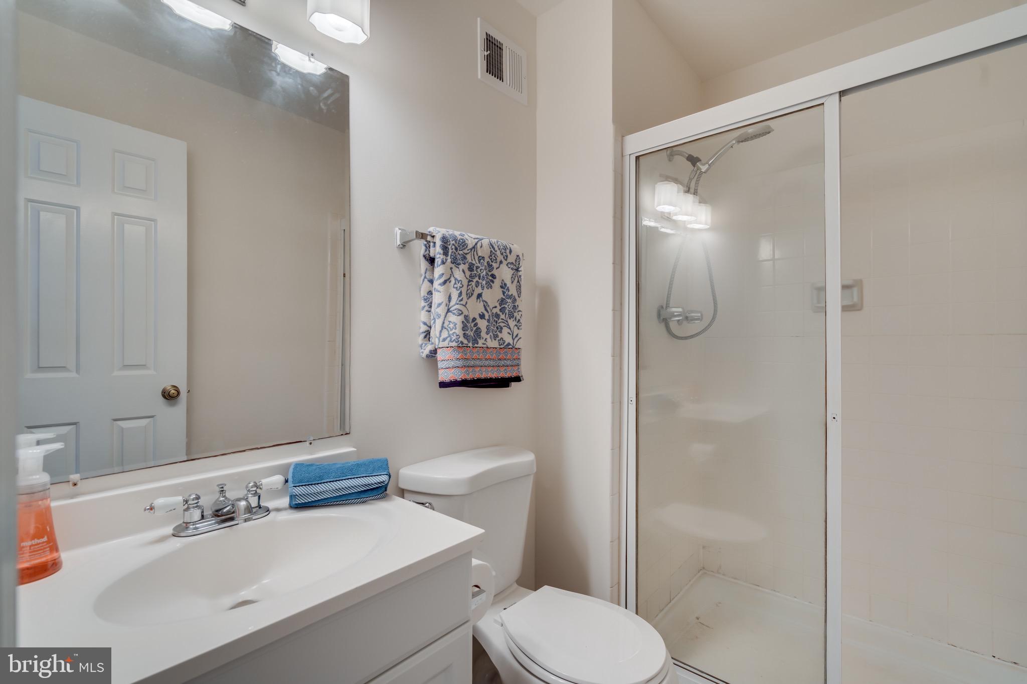 6490 Franconia Road Springfield, VA 22150 - Photo 16 of 34 a bathroom with a sink a toilet and shower