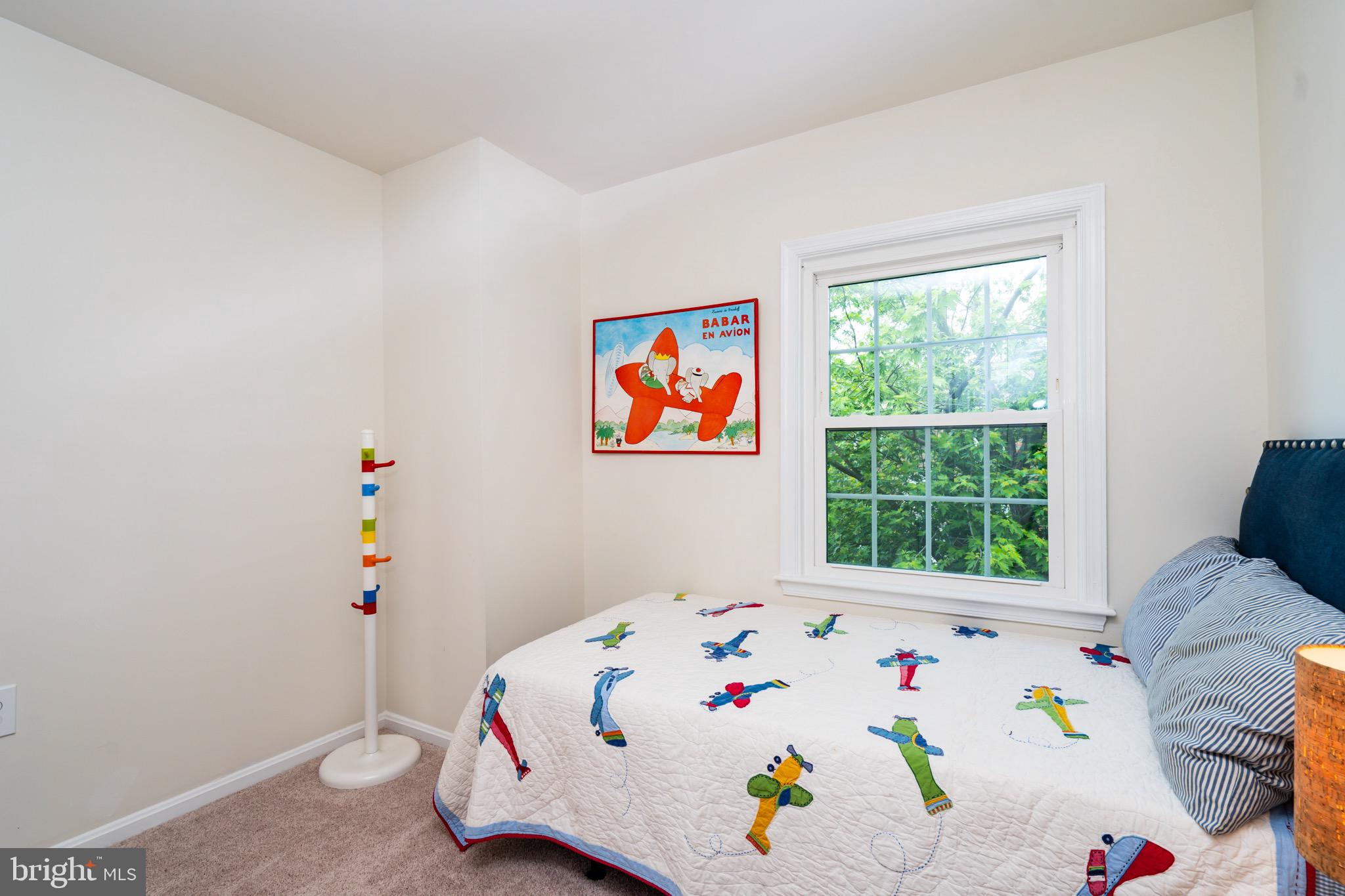 6490 Franconia Road Springfield, VA 22150 - Photo 18 of 34 a white bed sitting in a bedroom next to a window