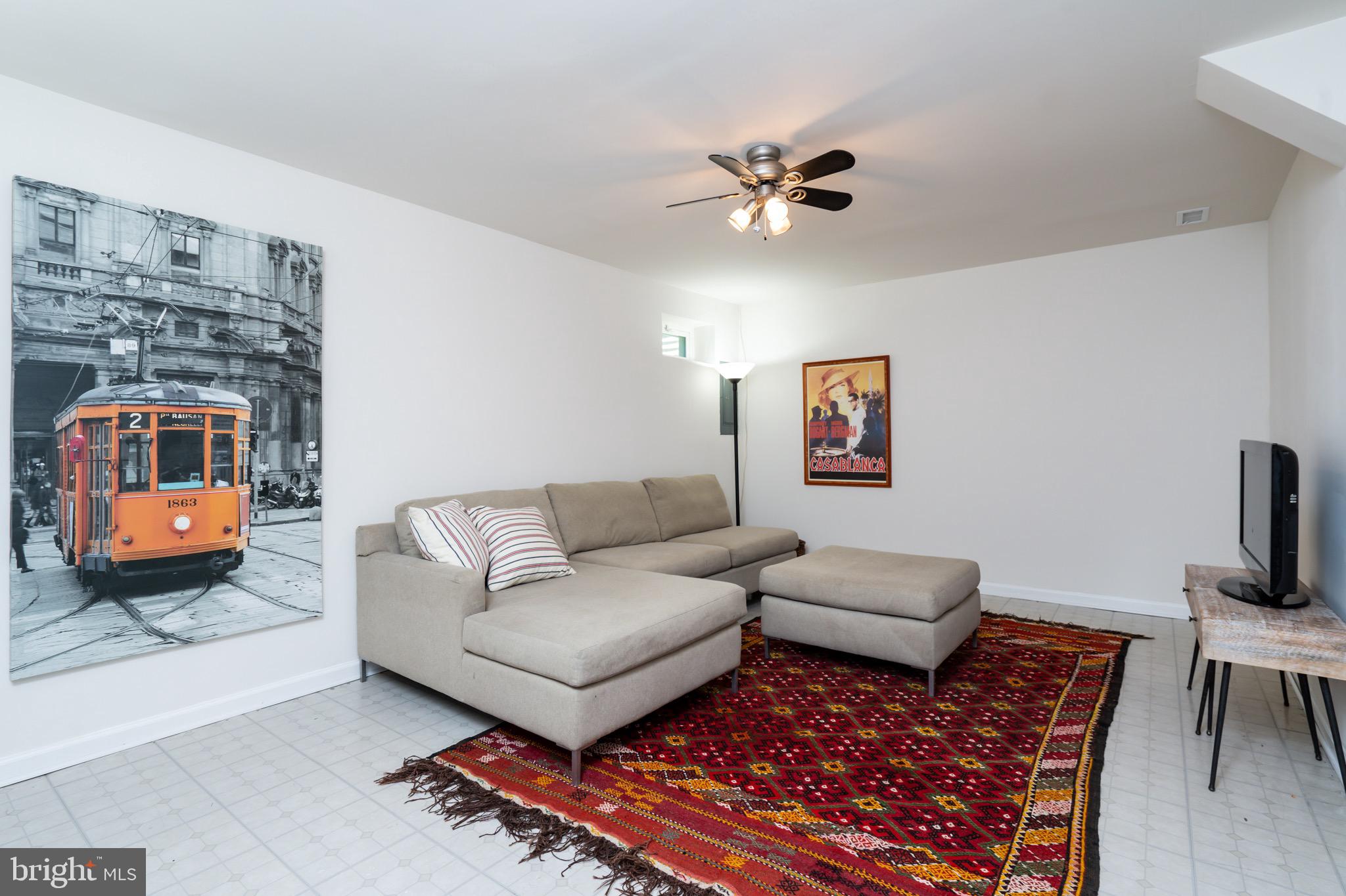 6490 Franconia Road Springfield, VA 22150 - Photo 25 of 34 a living room with furniture and a flat screen tv
