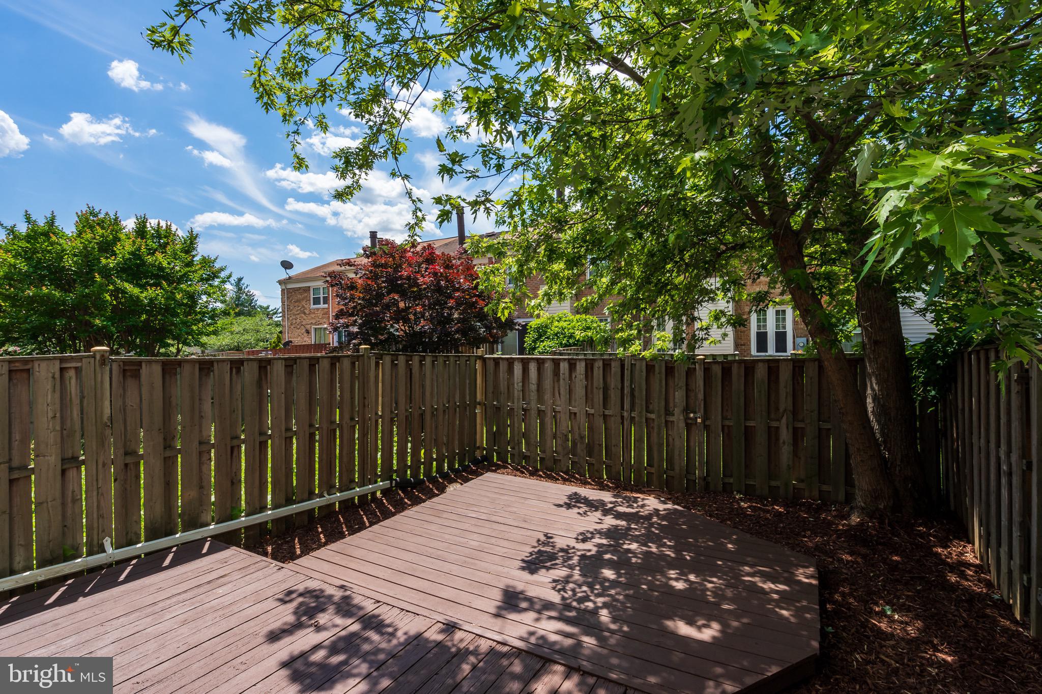 6490 Franconia Road Springfield, VA 22150 - Photo 31 of 34 a view of backyard with wooden fence and trees
