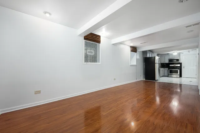 a view of a kitchen with a sink and a stove