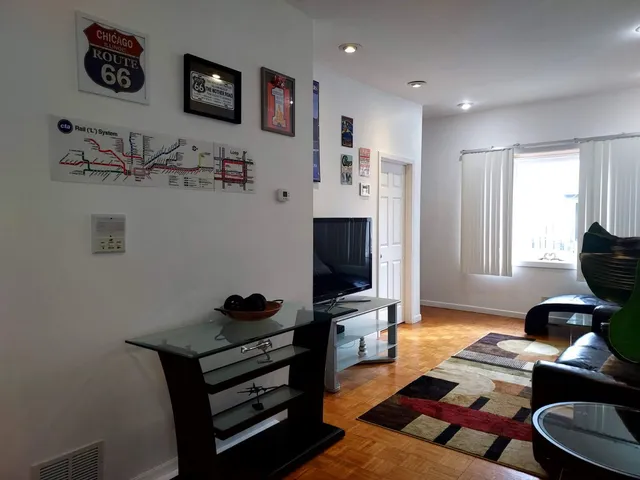 a workspace with furniture and a flat screen tv