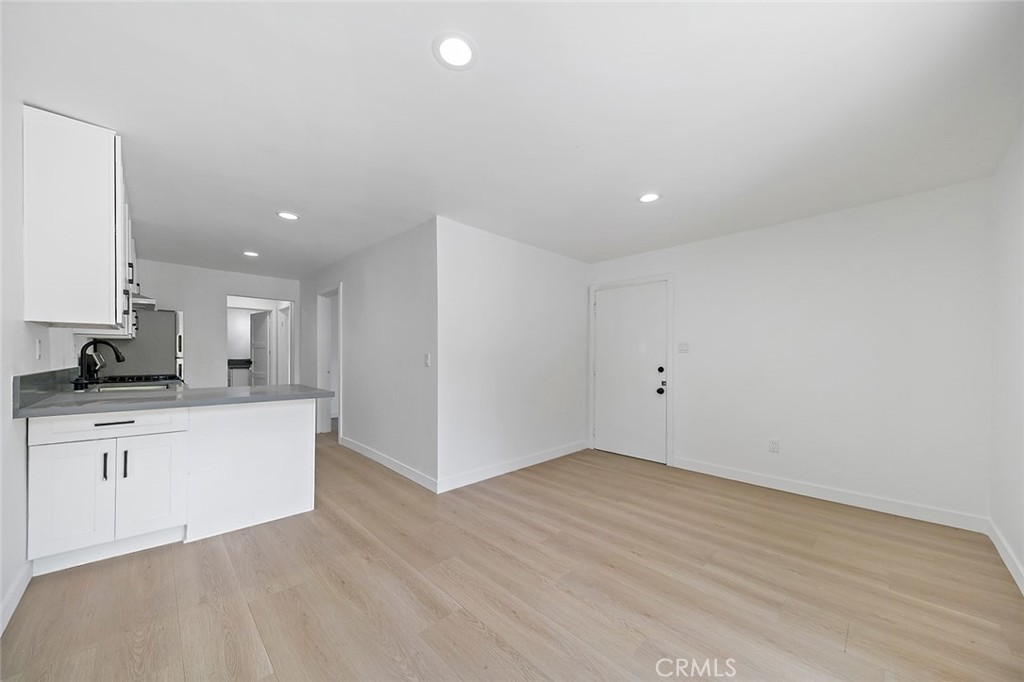 425 North Raymond Avenue Pasadena, CA 91103 - Photo 11 of 38 a view of a kitchen with cabinets and wooden floor