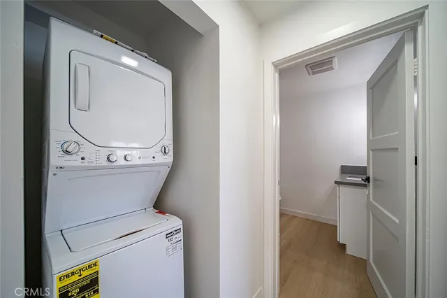 a view of bathroom with a toilet a sink and a mirror