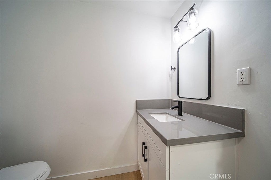 425 North Raymond Avenue Pasadena, CA 91103 - Photo 22 of 38 a bathroom with a sink and a mirror