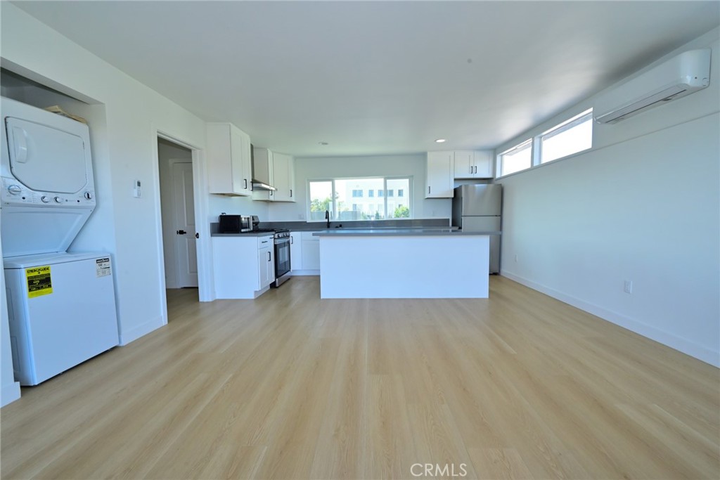 425 North Raymond Avenue Pasadena, CA 91103 - Photo 28 of 38 a view of a kitchen with a sink cabinets and wooden floor