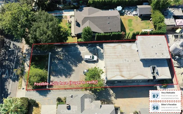 an aerial view of a house with outdoor space