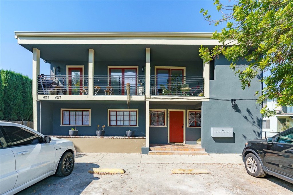 425 North Raymond Avenue Pasadena, CA 91103 - Photo 8 of 38 a view of a car park in front of a house