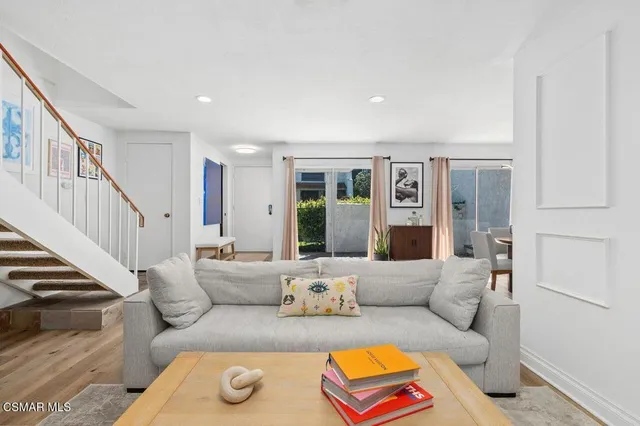 a living room with furniture and a rug