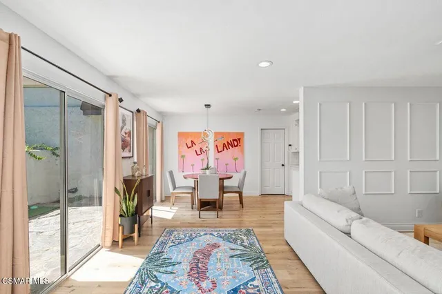 a living room with furniture and a rug